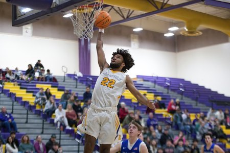 Tigers on a roll after a six-game winning steak, blowing past visiting Immanuel 75-58 Lemoore's Dorian Davis scores against Immanuel.